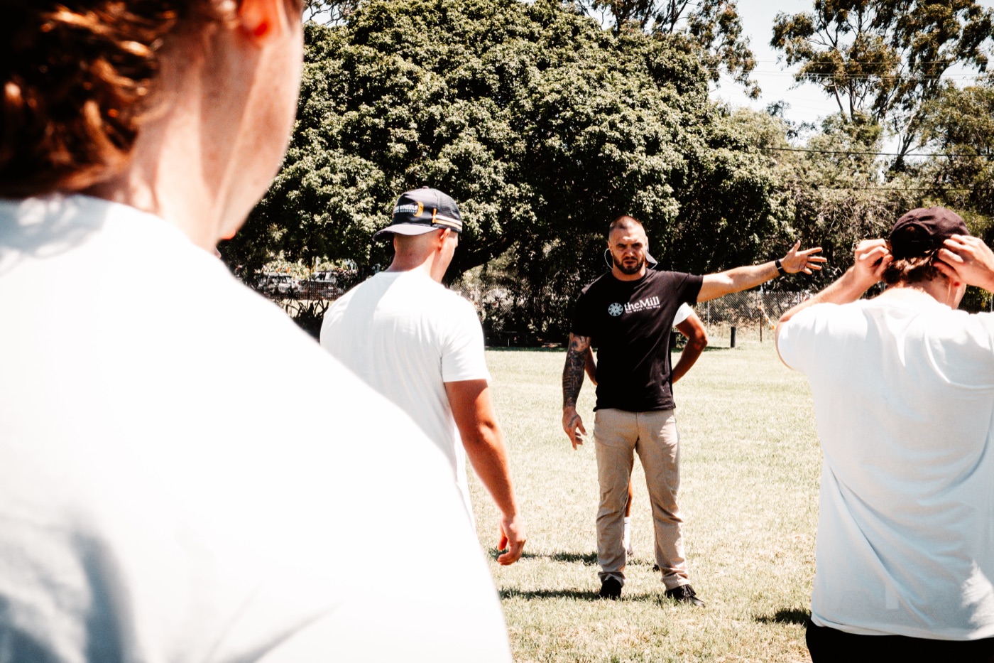 Benjamin coaching a group session outdoors
